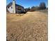 Large backyard with a wooden fence, ready for personalization and landscaping to create your dream outdoor space at 575 Dunagan Dr, Lawrenceville, GA 30045