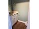 Powder room with stylish vanity and new hardwood flooring at 575 Dunagan Dr, Lawrenceville, GA 30045