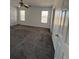 Bedroom features neutral carpet, lots of natural light and white trim at 575 Dunagan Dr, Lawrenceville, GA 30045