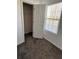 Bedroom featuring closet and window with natural light at 575 Dunagan Dr, Lawrenceville, GA 30045
