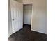 View of bedroom with open closet at 575 Dunagan Dr, Lawrenceville, GA 30045