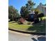 A welcoming community sign for Dunagan Farms surrounded by shrubs and trees at 575 Dunagan Dr, Lawrenceville, GA 30045