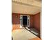 Covered front porch featuring brick accents, a dark front door, and neutral color palette at 575 Dunagan Dr, Lawrenceville, GA 30045