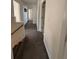 View of a hallway with carpeted steps at 575 Dunagan Dr, Lawrenceville, GA 30045