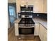 Kitchen with stainless steel appliances and granite countertops at 575 Dunagan Dr, Lawrenceville, GA 30045