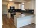 Charming kitchen featuring white cabinetry, stainless steel appliances and granite countertops at 575 Dunagan Dr, Lawrenceville, GA 30045