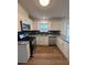 Bright kitchen featuring stainless steel appliances, granite countertops, and window at 575 Dunagan Dr, Lawrenceville, GA 30045