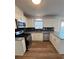 Bright kitchen featuring stainless steel appliances, granite countertops, and window at 575 Dunagan Dr, Lawrenceville, GA 30045