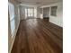 Spacious living room featuring hardwood floors, bright windows, and an open layout at 575 Dunagan Dr, Lawrenceville, GA 30045