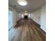 Large living room featuring hardwood floors, fireplace, large window and sliding glass door at 575 Dunagan Dr, Lawrenceville, GA 30045