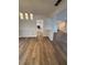 Open-concept living room with modern lighting and hardwood floors at 575 Dunagan Dr, Lawrenceville, GA 30045