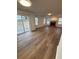 Inviting living room with hardwood floors, fireplace, and natural light from backyard-facing windows at 575 Dunagan Dr, Lawrenceville, GA 30045