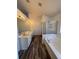 Bright main bathroom with double sinks, soaking tub, and glass shower at 575 Dunagan Dr, Lawrenceville, GA 30045
