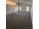 Spacious main bedroom with vaulted ceiling, fan, and ample natural light at 575 Dunagan Dr, Lawrenceville, GA 30045