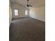 Large main bedroom with ceiling fan and large windows at 575 Dunagan Dr, Lawrenceville, GA 30045