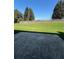 Concrete patio overlooking a spacious green backyard with a wooden fence, perfect for outdoor entertaining at 575 Dunagan Dr, Lawrenceville, GA 30045