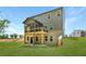 New construction home with a brick and siding exterior and a covered porch overlooking the green lawn at 4002 Adler Cir, Buford, GA 30519