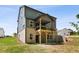 New construction home with a brick and siding exterior and a covered porch overlooking the yard at 4002 Adler Cir, Buford, GA 30519