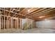 Unfinished basement with exposed ceiling and wooden frame ready to be transformed into a living space at 4002 Adler Cir, Buford, GA 30519