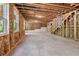 Unfinished basement with bare concrete floors and exposed framing ready to be transformed into a livable space at 4002 Adler Cir, Buford, GA 30519