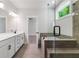 Large bathroom with soaking tub, shower, and dual sink vanity at 4002 Adler Cir, Buford, GA 30519