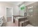 Bathroom with a glass enclosed shower and soaking tub at 4002 Adler Cir, Buford, GA 30519