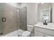 Modern bathroom features a glass-enclosed shower, stylish vanity and neutral finishes at 4002 Adler Cir, Buford, GA 30519