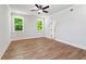 Bright bedroom with hardwood floors, big windows, and natural light at 4002 Adler Cir, Buford, GA 30519