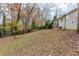 Spacious backyard with mature trees and a sloped lawn at 905 Fairburn Nw Rd, Atlanta, GA 30331