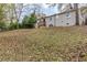 Large backyard with mature trees and a sloped lawn at 905 Fairburn Nw Rd, Atlanta, GA 30331