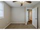 Cozy bedroom with carpet, window with blinds, and access to another room at 905 Fairburn Nw Rd, Atlanta, GA 30331