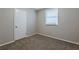 Charming bedroom with carpet, closet, and window with blinds at 905 Fairburn Nw Rd, Atlanta, GA 30331