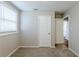 Bedroom with carpet, window, closet, and access to bathroom at 905 Fairburn Nw Rd, Atlanta, GA 30331