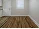 Bright dining area with wood-look floors and white door at 905 Fairburn Nw Rd, Atlanta, GA 30331