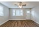 Living room features wood-look floors, neutral walls, and a ceiling fan at 905 Fairburn Nw Rd, Atlanta, GA 30331