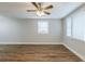 Living room with wood-look floors, neutral walls, and multiple windows at 905 Fairburn Nw Rd, Atlanta, GA 30331