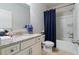 Clean bathroom featuring a vanity with solid surface countertop, toilet and shower-tub combination at 5915 Partners Pass, Cumming, GA 30028