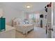 A cozy bedroom with a charming decor, with plenty of natural light at 5915 Partners Pass, Cumming, GA 30028