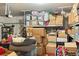 Overstuffed garage featuring abundant shelving and storage at 5915 Partners Pass, Cumming, GA 30028