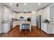 Spacious kitchen with a central island, stainless steel appliances, and white cabinets at 5915 Partners Pass, Cumming, GA 30028