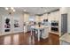 Modern kitchen features an island, stainless steel appliances, and a door to an outdoor space at 5915 Partners Pass, Cumming, GA 30028