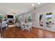 Open-concept living room with fireplace, hardwood floors, and access to a beautiful outdoor patio at 5915 Partners Pass, Cumming, GA 30028