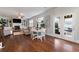 Cozy living room with fireplace, built-ins, and French doors to the backyard at 5915 Partners Pass, Cumming, GA 30028