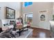 Bright living room with large windows, and elegant decor at 5915 Partners Pass, Cumming, GA 30028
