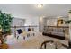 Loft space with neutral carpeting, comfortable seating, and railings at 5915 Partners Pass, Cumming, GA 30028