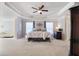 Spacious main bedroom with tray ceiling, lots of carpet and a chaise lounge at 5915 Partners Pass, Cumming, GA 30028