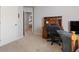 Office space with a desk, chair, and doorway view of other rooms at 5915 Partners Pass, Cumming, GA 30028