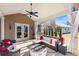 Relaxing outdoor living space with a covered patio, fire pit, and comfortable seating arrangements at 5915 Partners Pass, Cumming, GA 30028