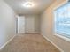 Cozy bedroom with window and double door closet at 2098 Mallard Crst, Lithonia, GA 30058