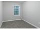 Simple bedroom with neutral walls and carpet at 2098 Mallard Crst, Lithonia, GA 30058
